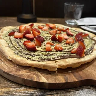 Dubai Chocolate Pizza — dessert pizza with pistachio kataifi, Nutella and fresh strawberries at Pizza Master